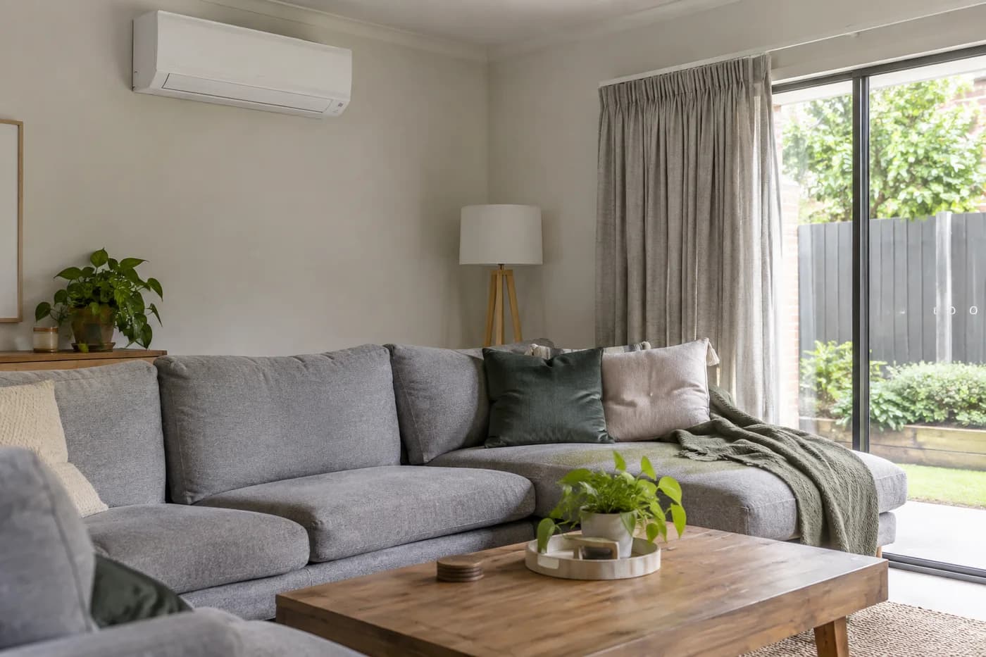 Wall-mounted split system in a naturally lit family living room